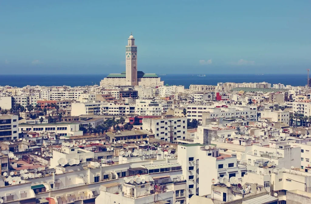 Casablanca and Marrakech city comparison showing modern Casablanca and historic Marrakech medina