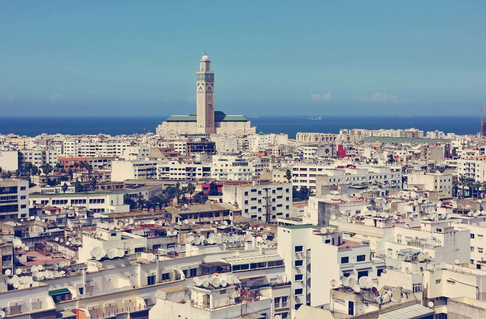 Casablanca and Marrakech city comparison showing modern Casablanca and historic Marrakech medina